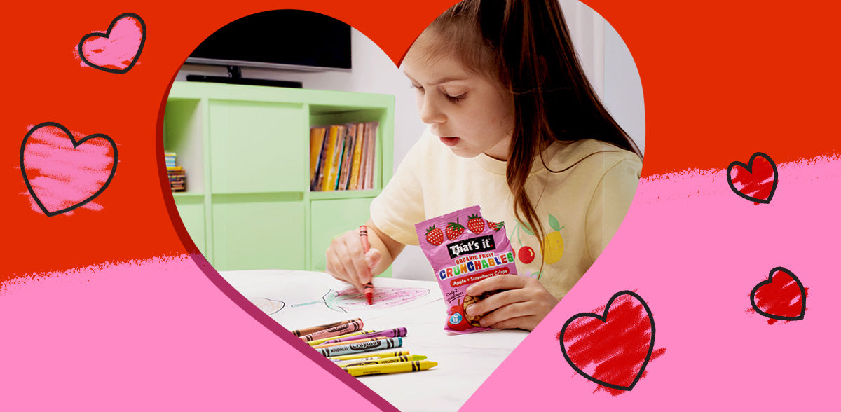 Valentine Snacks Kids Love. Girl coloring while holding Strawberry Fruit Crunchables