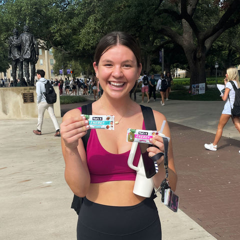 College Student with a That's it. Energy Bar