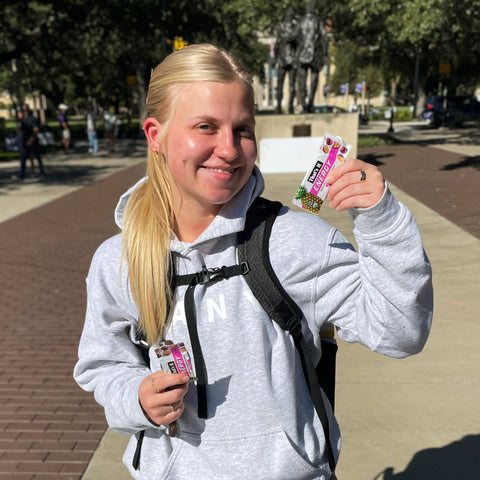 College Student with a That's it Energy Bar